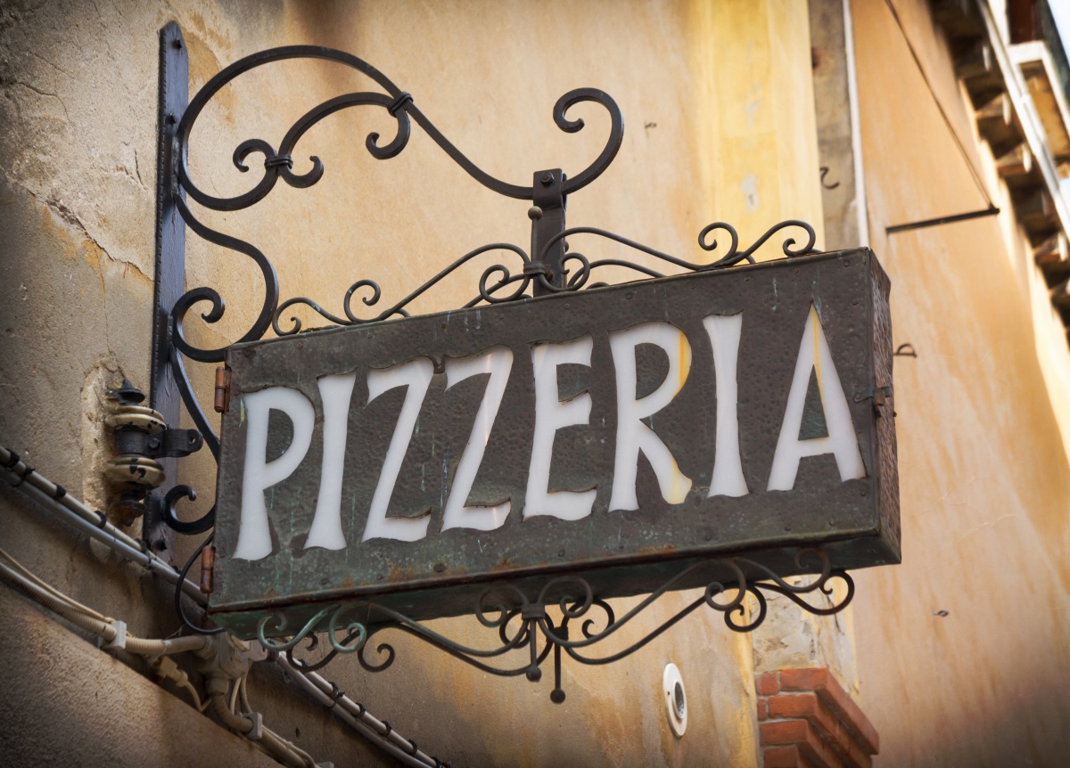 Pizzaria in Italy. Eating Pizza in Italy.