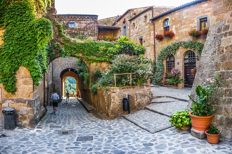Beautiful view of alleyway in Civita di Bagnoregio near Tiber river valley in Lazio, Italy
