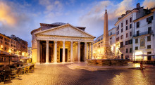  The Pantheon in Rome, Italy at dawn with a bustling street cafe and city lights
